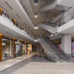 Modern shopping mall with escalators inside