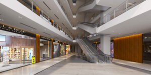 Modern shopping mall with escalators inside